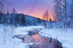 A frozen river at sunrise  in a wintry landscape  near Levi in Finnish Lapland  (Photo: Discover Airlines)